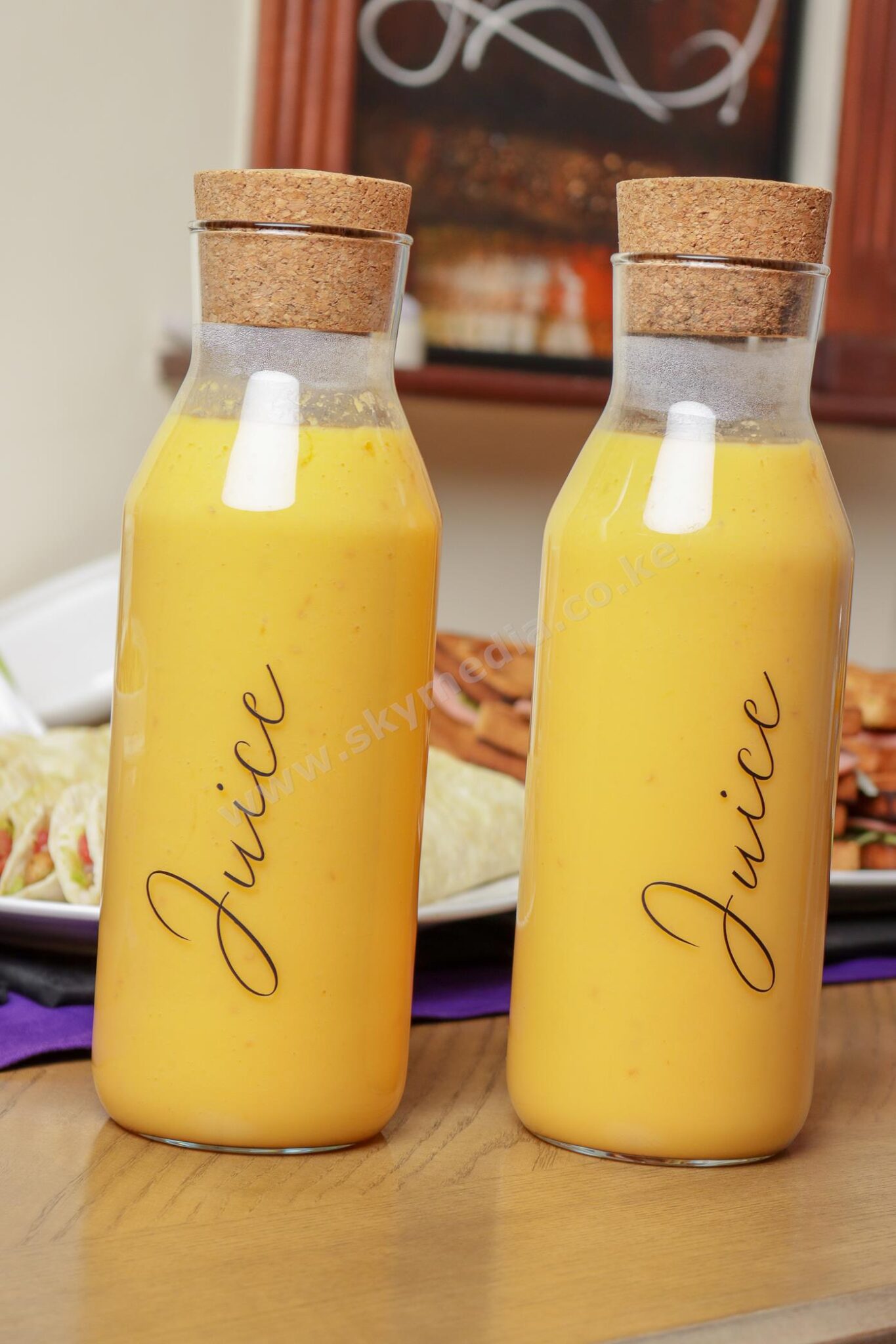 Interior of a craft shop selling colorful African clothing, bags, and art